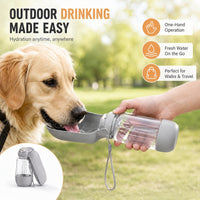 Golden retriever drinking from the ChillBottle fold-out bowl held in one hand